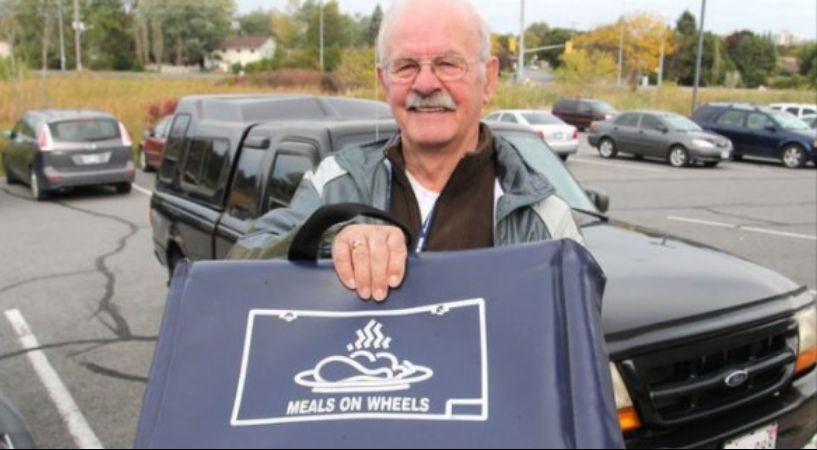 Meals on Wheels volunteer with bag